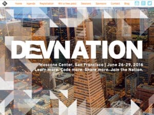 DevNation 2016 website. A screenshot of website for a technology conference. The top navigation bar shows a grey and white flag emblem with navigation links in a friendly, yellow font and below that a large masthead photo of a vista of downtown San Francisco with the word "DevNation" in large white letters overlaid on top