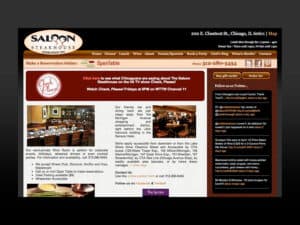 Saloon Steakhouse website. A screenshot of a website for a Chicago steakhouse has a design scheme with blacks, maroons and a wood finishes to convey the appearance of an upscale, white tablecloth restaurant. Some photos of steaks, dinner entrees and the restaurant's interior are seen with copy throughout the page. The logo in the upper-left is an oval shape with the words "Saloon Steakhouse, Established 1991" in which the two o's in Saloon are also the tops of two round martini glasses