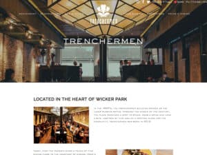Trenchermen website. A screenshot of a website home page. A photo showing a wide view of a rustic yet modern restaurant interior with brick walls and warm lighting with diners throughout is overlaid by the Trencherman fleur emblem, some page links in a row and the name Trenchermen. Below that is a section of web page with some more photos of diners and a copy section (illegible) with the heading "located in the hear of Wicker Park"